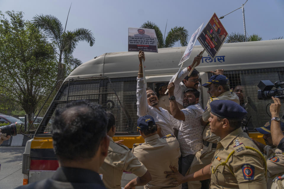 Members of opposition Congress party who were demanding an investigation into allegations of fraud and stock manipulation by India's Adani Group are taken away in a police vehicle outside National Stock Exchange in Mumbai, India, Wednesday, March 1, 2023. The Adani Group suffered a massive sell-off of its shares after a U.S.-based short-selling firm, Hindenburg Research, accused it of various fraudulent practices. The Adani Group has denied any wrongdoing. (AP Photo/Rafiq Maqbool)