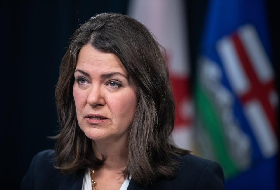 Alberta Premier Danielle Smith was asked Thursday about a story in the Globe and Mail that reported the government directed the provincial health authority to remove references to COVID-19 and influenza from advertisements for its immunization campaign. (Jason Franson/The Canadian Press - image credit)