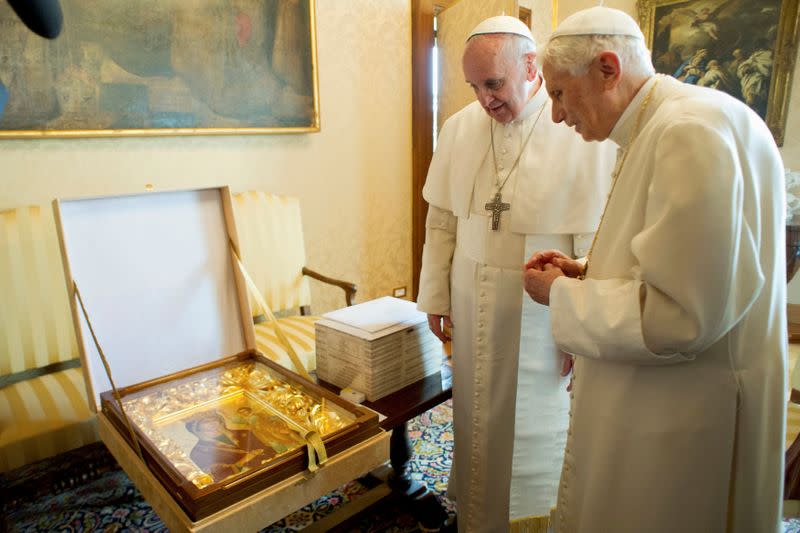 FILE PHOTO: Pope Francis exchanges gift with Pope Emeritus Benedict XVI at the Castel Gandolfo summer residence