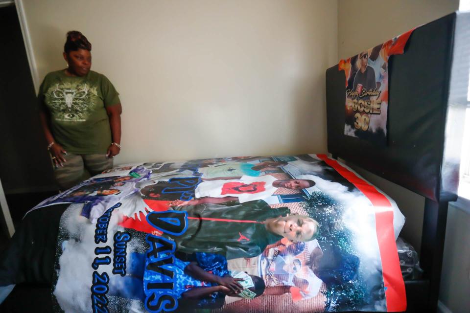 Wendy Davis stands at the foot of her grandson Erick's bed that has been made into a memorial for him.