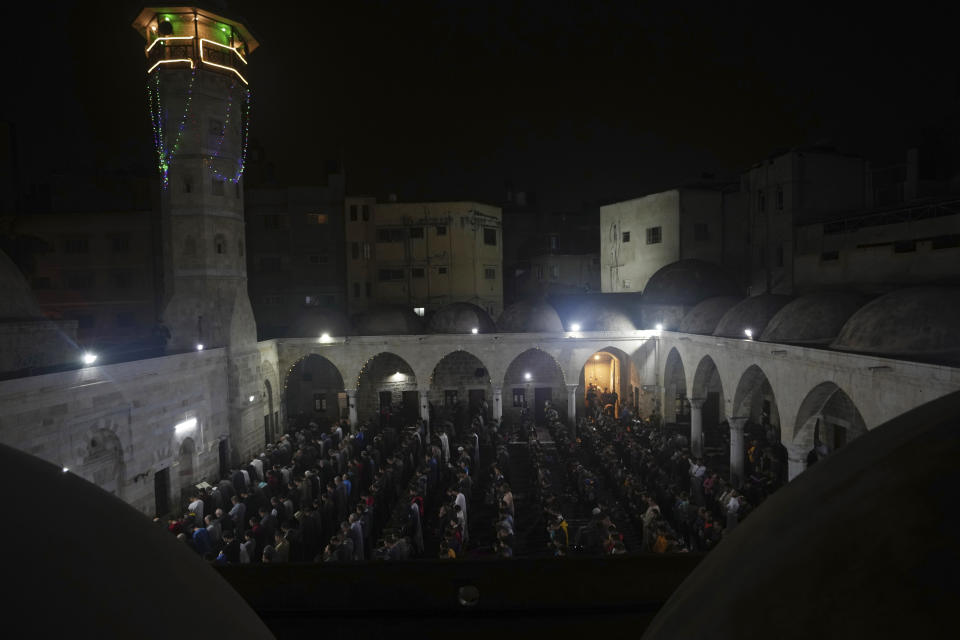 Palestinian Muslim worshippers pray during Laylat al-Qadr, also known as the Night of Destiny, at al Sayed Hashim mosque in Gaza City, early Tuesday, April 18, 2023. Laylat al-Qadr is marked on the 27th day of the holy fasting month of Ramadan and is commemorated as the night Prophet Muhammad received the first revelation of the Quran. Muslims traditionally spend the night in prayer and devotion. (AP Photo/Adel Hana)