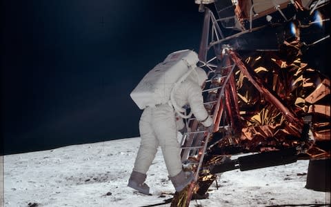 Aldrin prepares to take his first step on the moon - Credit: NASA