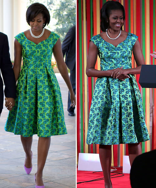 <div class="caption-credit"> Photo by: Getty Images</div><b>Barbara Tfank green dress</b> <br> Back in September 2010, the first lady joined the president in presenting the Medal of Honor while wearing this stunning patterned dress (left). She also wore it to the first ever White House Kids State Dinner in August 2012 (right). <br>