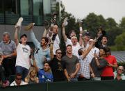 Britain Tennis - Wimbledon - All England Lawn Tennis & Croquet Club, Wimbledon, England - 27/6/16 Fans of Great Britain's Marcus Willis hold up shoes during his match against Lithuania's Ricardas Berankis REUTERS/Stefan Wermuth