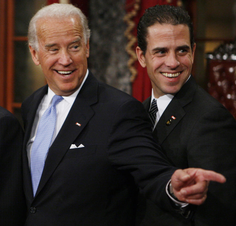 FILE - Then Vice President-elect, Sen. Joe Biden, D-Del., left, stands with his son Hunter during a re-enactment of the Senate oath ceremony in the Old Senate Chamber on Capitol Hill in Washington on Jan. 6, 2009. Hunter Biden, an ongoing target for conservatives, has a memoir coming out April 6. The book is called “Beautiful Things” and will center on the younger Biden's well publicized struggles with substance abuse, according to his publisher. (AP Photo/Charles Dharapak, File)