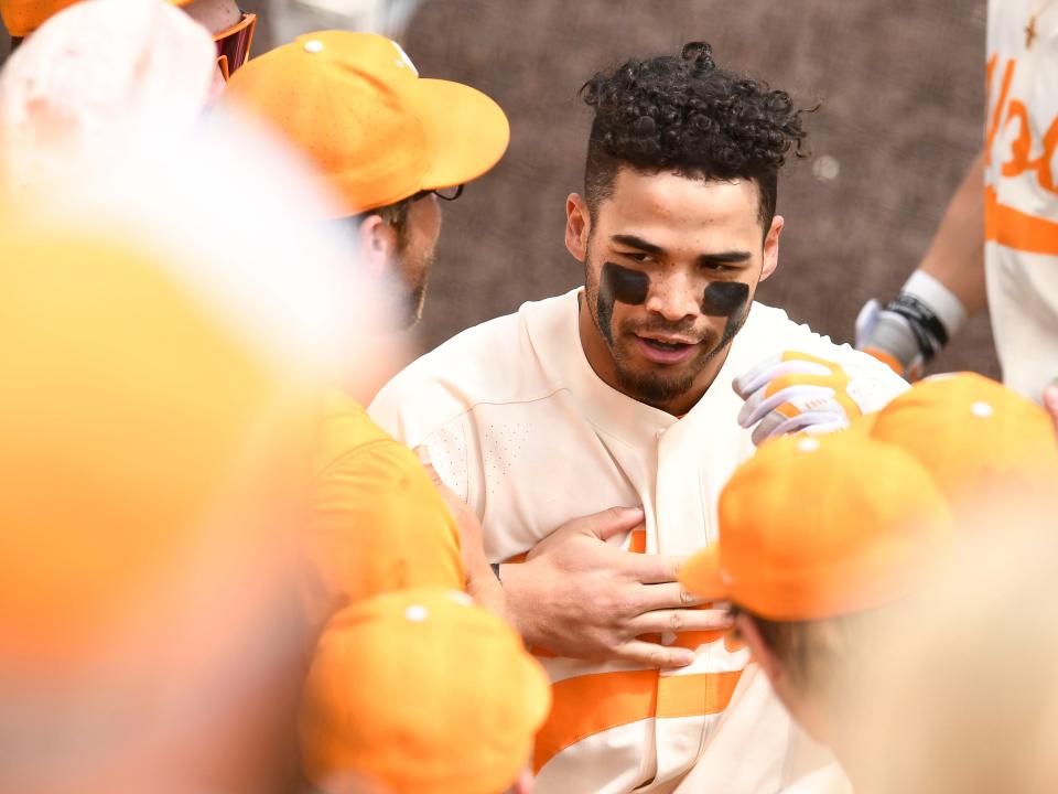 Tennessee's Jorel Ortega (2) is greeted by teammates after his 3-run homer against Alabama during the NCAA baseball game in Knoxville, Tenn. on Sunday, April 17, 2022. 