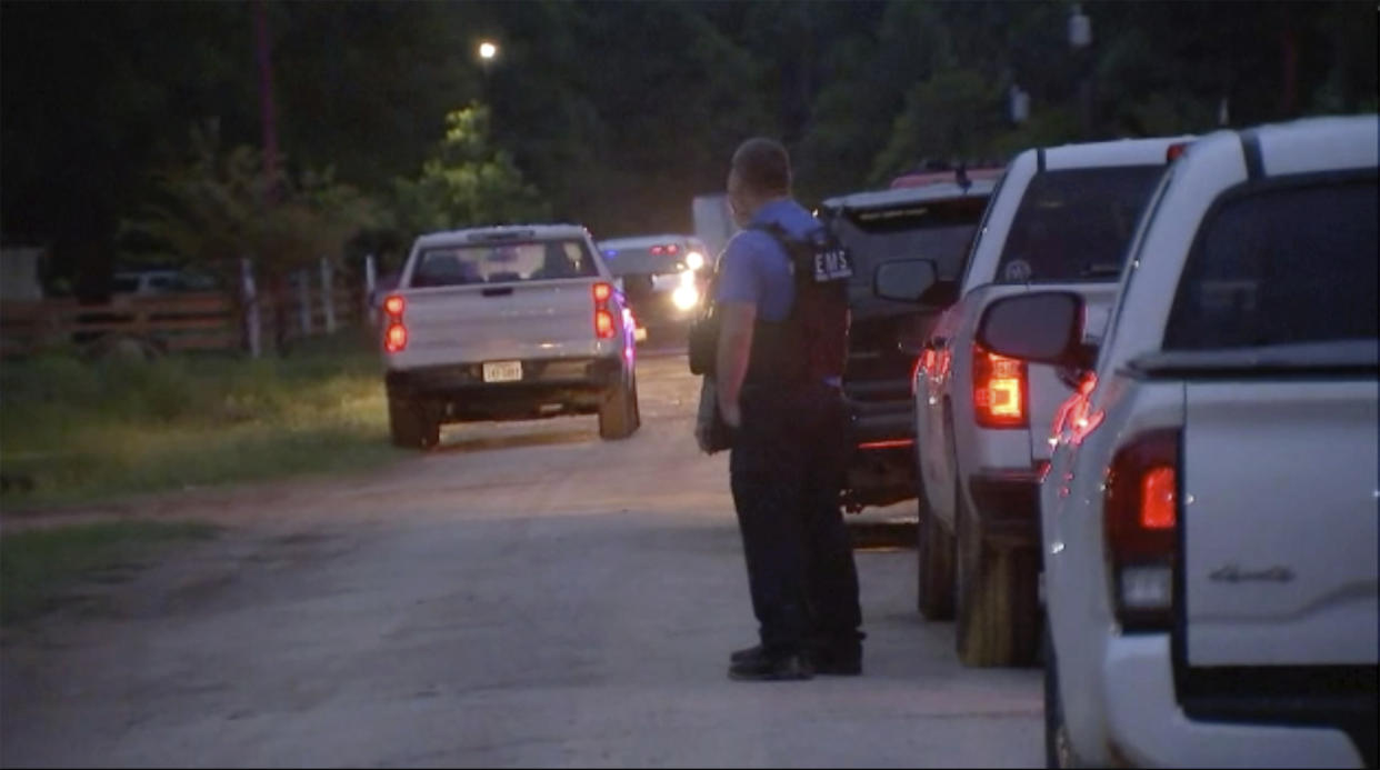 Police respond to the scene of a shooting early Saturday, April 29, 2023 in Cleveland, Texas. A man went next door with a rifle and began shooting his neighbors, killing several including an 8-year-old inside the house, after the family asked him to stop firing rounds in his yard because they were trying to sleep, authorities said Saturday. (KTRK via AP)