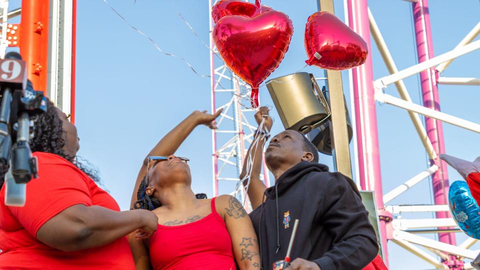 People including family gathered at a vigil outside Orlando FreeFall Monday to honor 14-year-old Tyre Sampson, who fell from the ride and died last week.