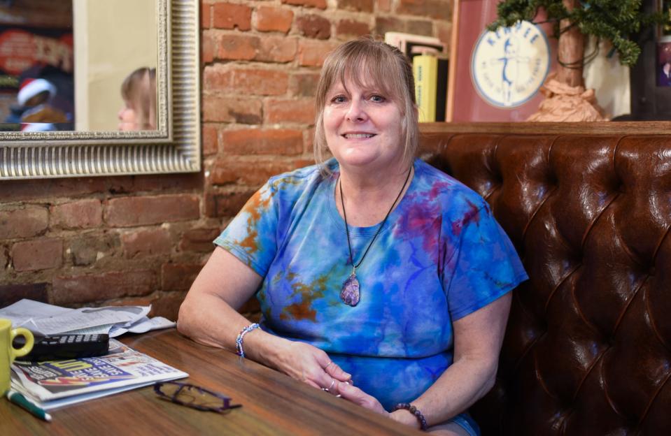 Tammie Bunker of Weston's Kewpee Sandwich Shoppe poses for a portrait Wednesday, Nov. 30, 2022, at the restaurant where she's worked for four decades.