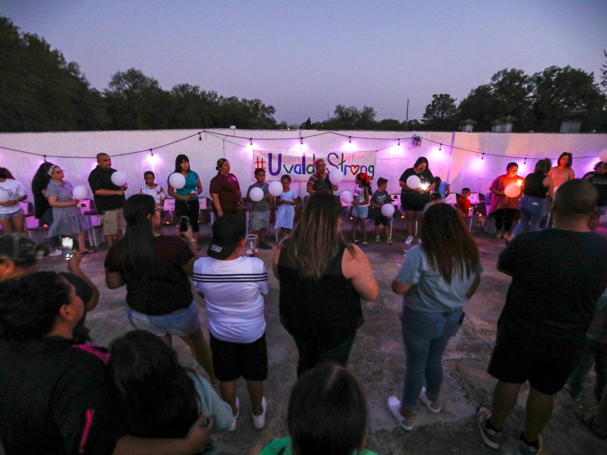 People attend a candlelight vigil in Uvalde, Texas, United States on May 30, 2022, remembering the victims of a school shooting where 19 children and two adults were killed during the massacre at Robb Elementary School.