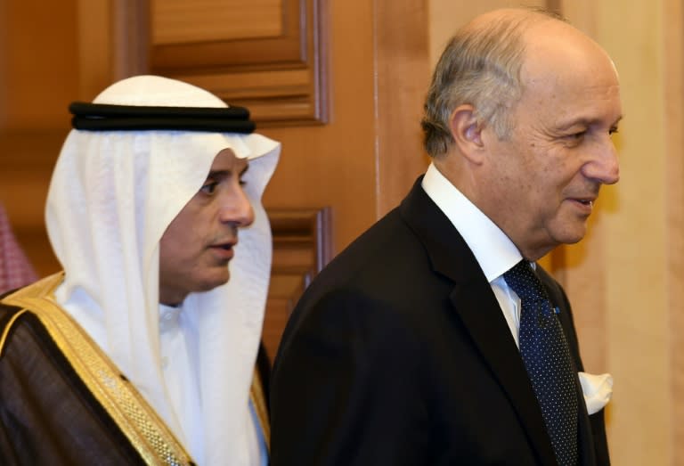 French Minister of Foreign Affairs Laurent Fabius (R) arrives for a joint press conference with his Saudi counterpart Adel al-Jubeir in Riyadh on October 13, 2015