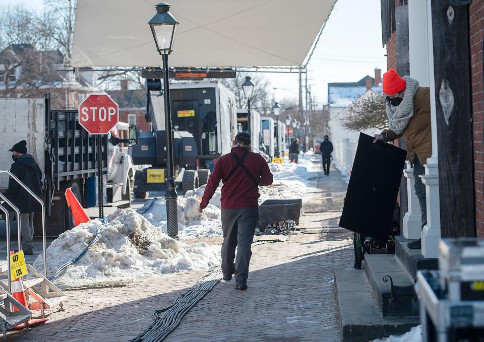 Equipment trucks lined Church Street for the filming of the Netflix movie, "The Pale Blue Eye" at Old Economy Village, Friday in Ambridge.