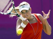 Canada's Aleksandra Wozniak returns a shot from New Zealand's Marina Erakovic during her first round tennis match at the 2012 Summer Olympics Monday, July 30, 2012 in at the All England Club in Wimbledon. THE CANADIAN PRESS/Ryan Remiorz