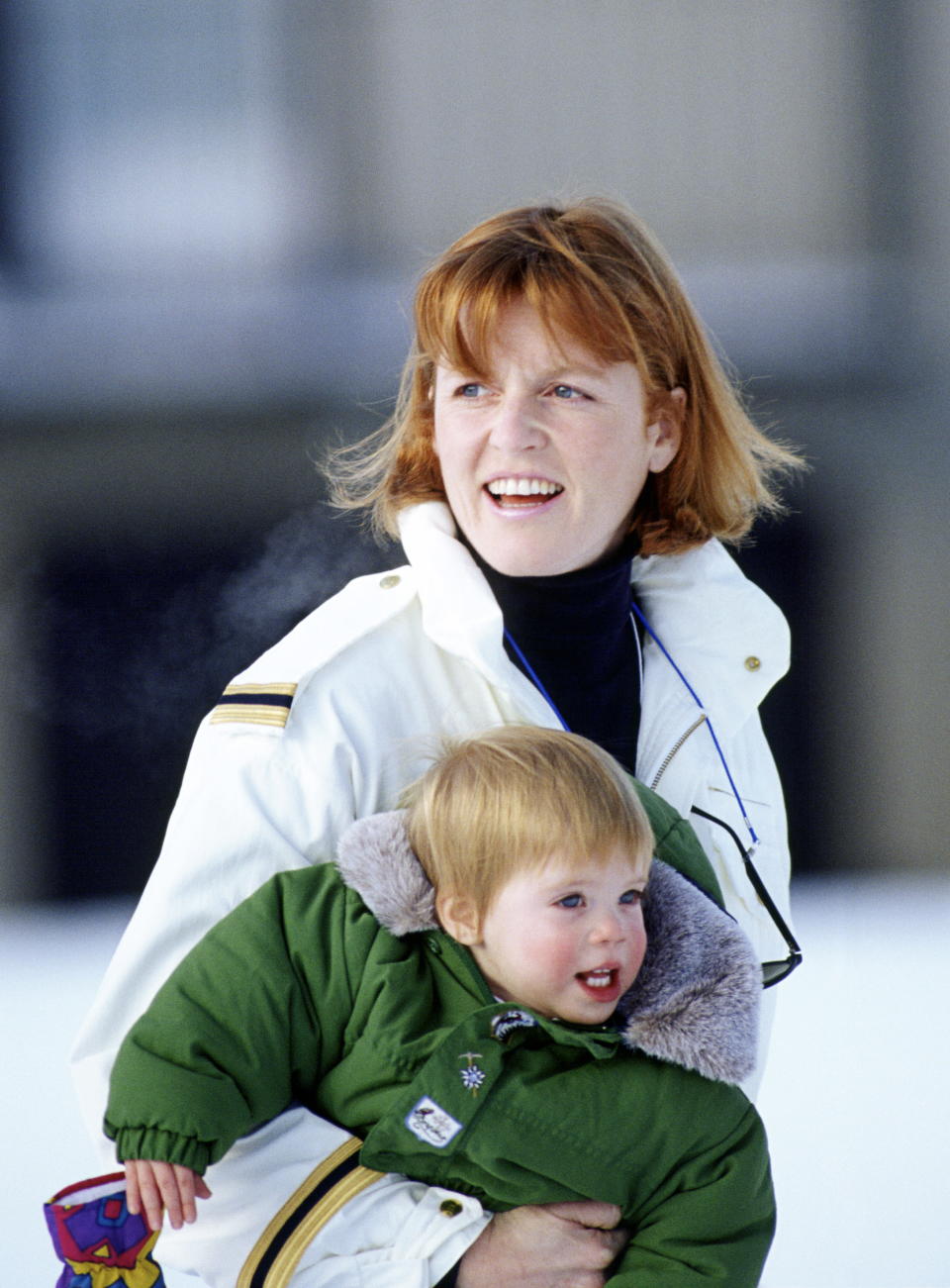 Sarah Ferguson pictured carrying Princess Eugenie during a skiing holiday in 1992. [Photo: Getty]