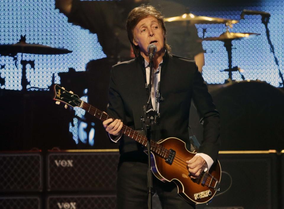 FILE - This May 18, 2013 file photo shows Paul McCartney performing during the first U.S. concert of his "Out There" tour, in Orlando, Fla. It's a crowded tour market and everyone is competing for your entertainment dollar. McCartney is inventive when it comes to tour plotting and can still excite with an expansive catalog of enduring hits. His stop at Bonnaroo this year is one of the summer's most anticipated moments. (AP Photo/John Raoux, file)