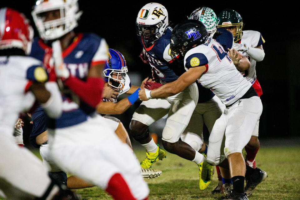 Richard Young  of the South team runs for yards during the Rotary South All-Star Classic at Fort Myers High School on Wednesday, Dec. 7, 2022. South won over the North team. 