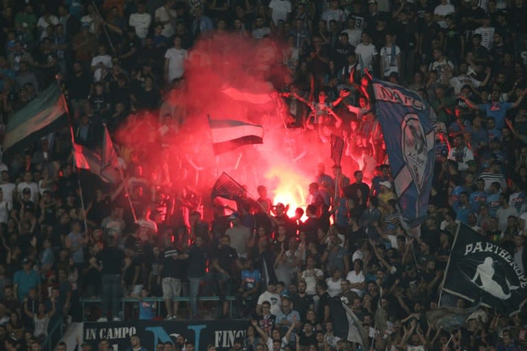 Napoli's fans celebrate at the end of their match against Benfica on September 28, 2016