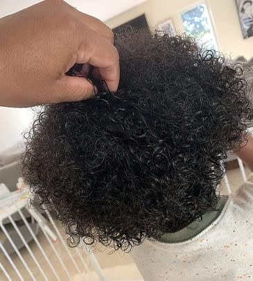 A curly hair children's leave-in detangling conditioner made with jojoba oil, vitamin B5 and plum seed oil