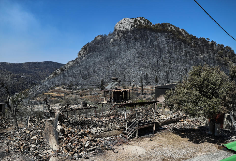 ANTALYA, TURKEY - AUGUST 02: A view of the damaged building and the area after forest fires in Kepezbeleni neighborhood in Akseki district of Antalya, Turkey on August 02, 2021. (Photo by Islam Yakut/Anadolu Agency via Getty Images)