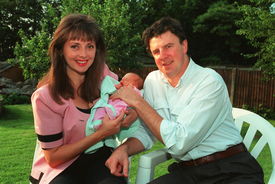 Television presenter Carol Vorderman and her husband Paddy King show off their new baby Katie