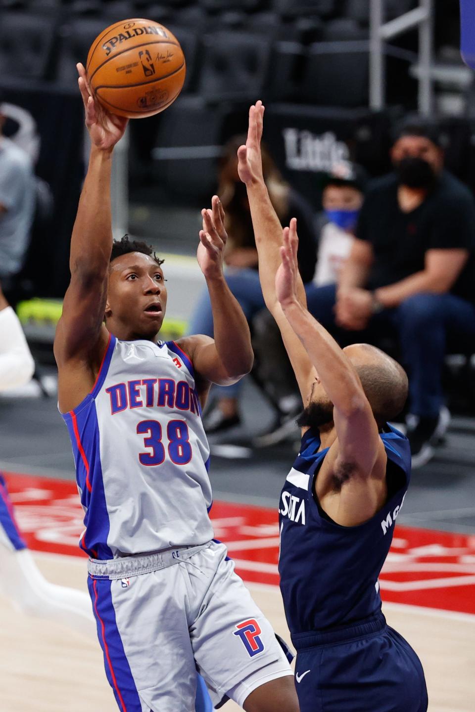 Detroit Pistons guard Saben Lee (38) shoots on Minnesota Timberwolves guard Jordan McLaughlin (6) in the first half at Little Caesars Arena on May 11, 2021.