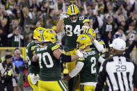 Green Bay Packers place kicker Mason Crosby (2) celebrates with teammates after kicking a 31-yard field goal during overtime in an NFL football game against the New England Patriots, Sunday, Oct. 2, 2022, in Green Bay, Wis. The Packers won 27-24. (AP Photo/Matt Ludtke)