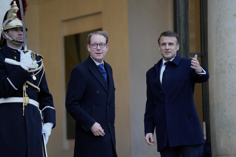 French President Emmanuel Macron, right, poses with Sweden's Foreign Minister Tobias Billstrom at the Elysee Palace in Paris, Monday, Feb. 26, 2024. More than 20 European heads of state and government and other Western officials are gathering in a show of unity for Ukraine, signaling to Russia that their support for Kyiv isn't wavering as the full-scale invasion grinds into a third year. (AP Photo/Lewis Joly)