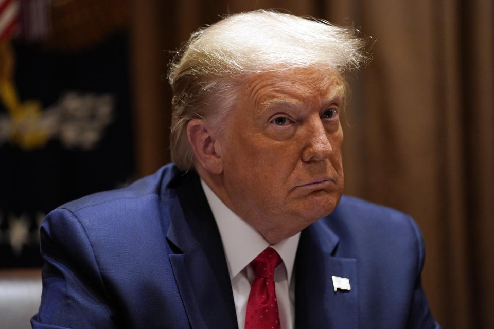 President Donald Trump listens during a roundtable meeting with Hispanic leaders in the Cabinet Room, Thursday, July 9, 2020, in Washington. (AP Photo/Evan Vucci)