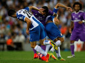 Football Soccer - Espanyol v Real Madrid - Spanish La Liga Santander - RCDE stadium, Cornella - El Prat, Spain - 18/09/16 Real Madrid's James Rodriguez and Espanyol's Gerard Moreno and Marc Roca in action. REUTERS/Albert Gea