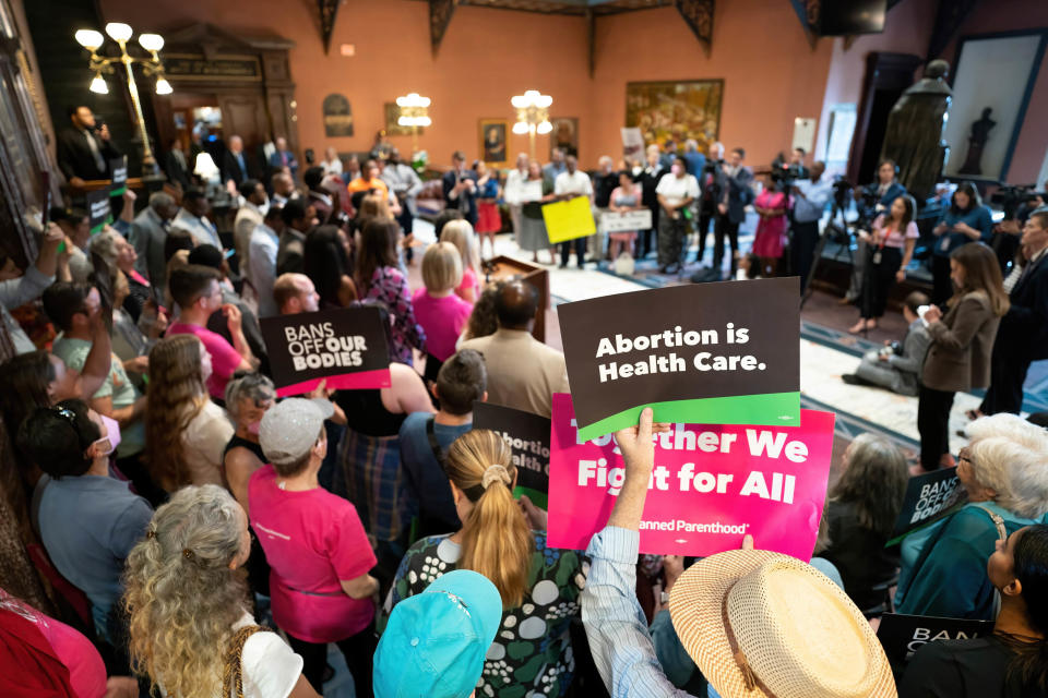 Demonstrators and lawmakers gather with signs and placards in the lobby of the South Carolina Statehouse on May 16, 2023, where South Carolina Gov. Henry McMaster called the state House back into session to debate on an amended version of the state Senate's 6-week abortion ban bill. / Credit: Sean Rayford/SOPA Images/LightRocket via Getty Images