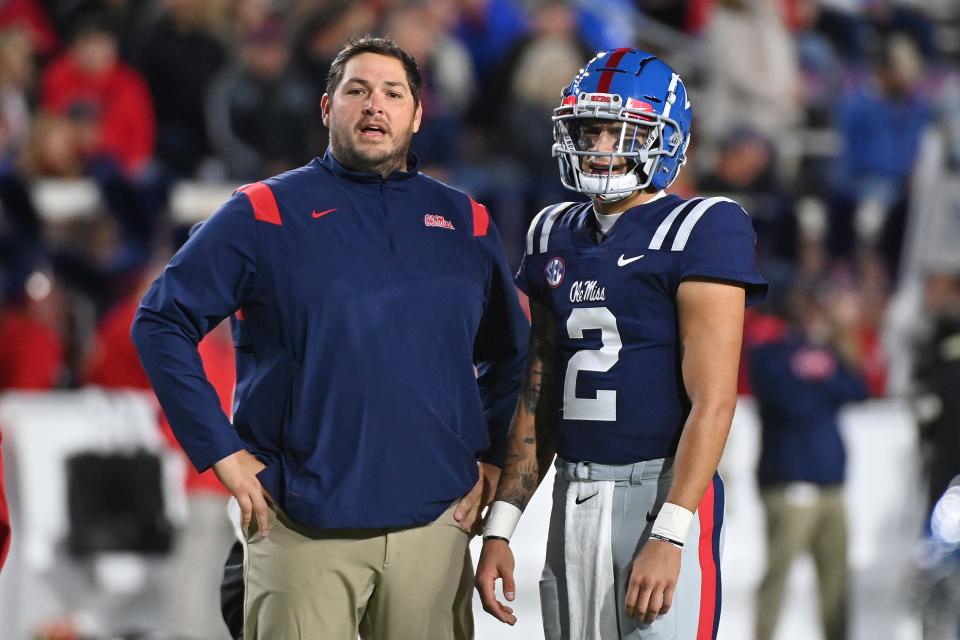 Mississippi offensive coordinator Jeff Lebby talks to quarterback Matt Corral before facing Vanderbilt on Nov. 20 in Oxford, Miss.