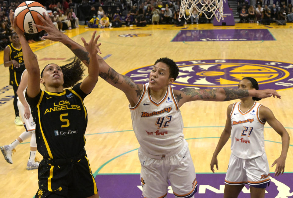 Phoenix Mercury center Brittney Griner blocks a shot by Los Angeles Sparks guard Dearica Hamby in the first half of their season-opening game at Crypto.com Arena in Los Angeles on May 19, 2023. (Jayne Kamin-Oncea/USA TODAY Sports)