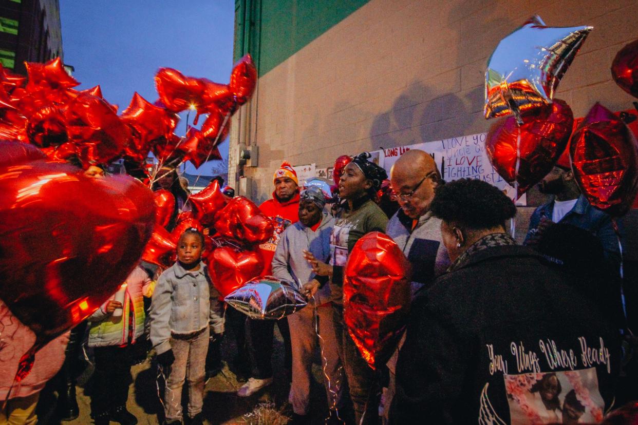 Candice Gay, Quillan Jacobs’ sister, speaks to a crowd of friends and family during a vigil for Jacobs on Friday evening outside of the Second Baptist Church in downtown Columbia. Jacobs, a suspect in an overnight gunfight Nov. 14, was shot and killed by police after the incident left five people injured.