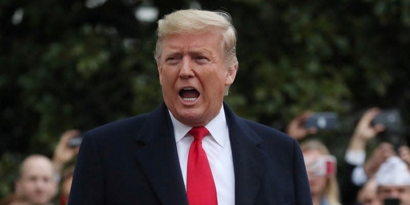 FILE PHOTO: U.S. President Donald Trump talks to reporters as he departs for travel to New Orleans, Louisiana from the South Lawn of the White House in Washington, U.S., January 13, 2020. REUTERS/Leah Millis/File Photo