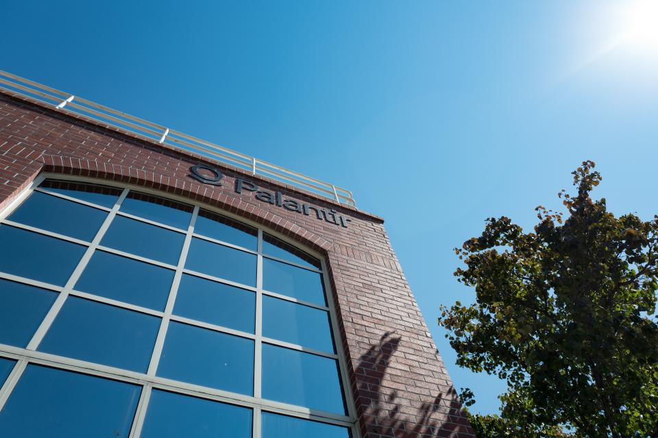 Logo and signage at the headquarters of big data analytics company Palantir, in the Silicon Valley town of Palo Alto, California, August 25, 2016. (Photo via Smith Collection/Gado/Getty Images).