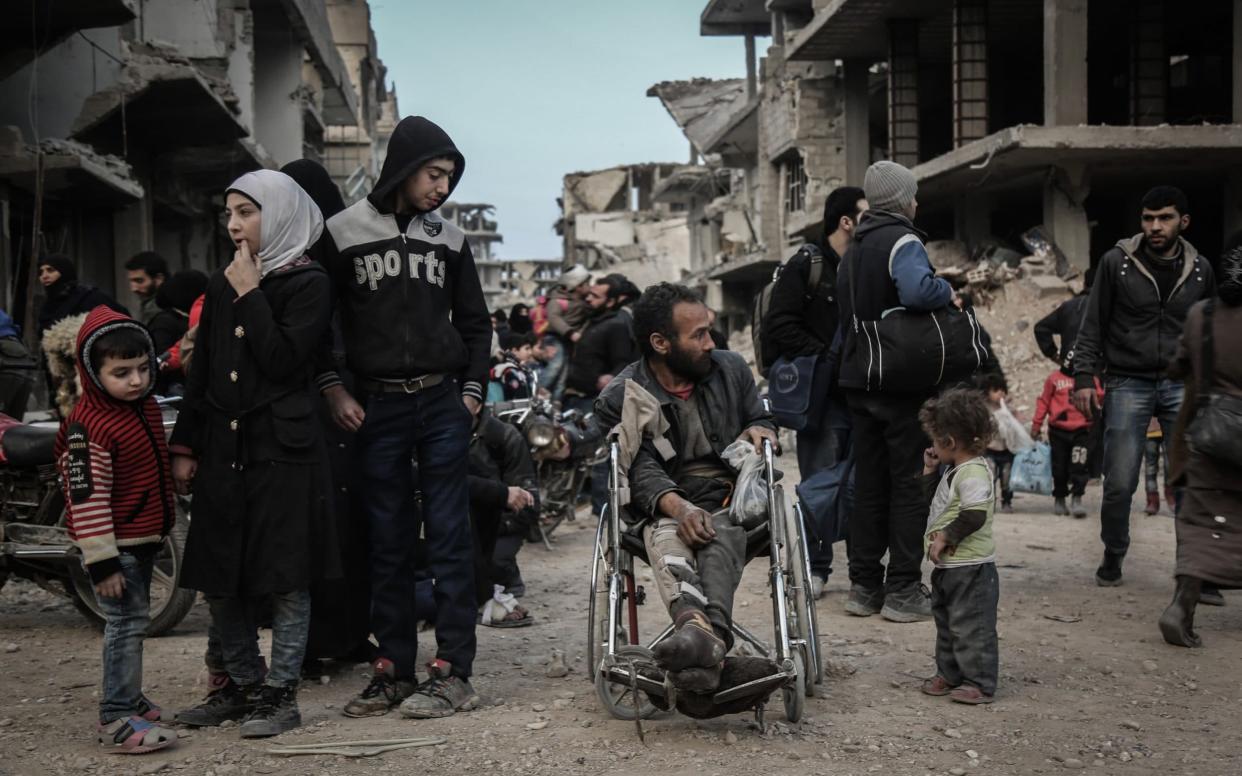 Civilians wait to be evacuated from Syria's eastern Al-Ghouta province outside Damascus, Syria, - Photoshot/Avalon.red