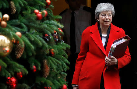 FILE PHOTO: Britain's Prime Minister Theresa May leaves 10 Downing Street in London, Britain, December 5, 2018. EUTERS/Peter Nicholls