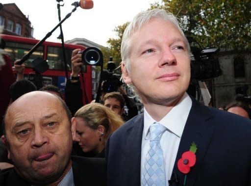 WikiLeaks founder Julian Assange (R) arrives at London's High Court. Assange on Wednesday lost a bitter legal battle to block his extradition from Britain to Sweden to face questioning over allegations of rape and sexual assault