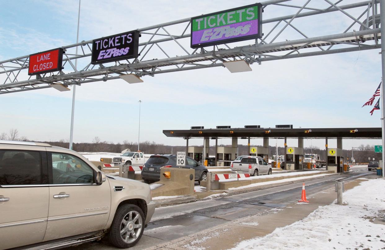 Motorists enter and exit the Ohio Turnpike at the State Route 8 toll Plaza in Boston Heights.