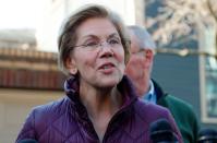 Senator Elizabeth Warren talks to reporters after telling her staff she is withdrawing from 2020 U.S. presidential race outside her home in Cambridge, Massachusetts