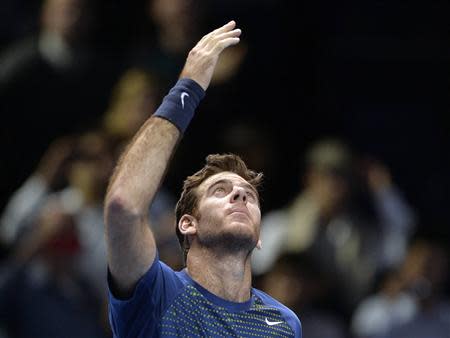 Juan Martin del Potro of Argentina celebrates after defeating Richard Gasquet of France during their ATP World Tour Finals tennis match at the O2 Arena in London, November 4, 2013. REUTERS/Toby Melville