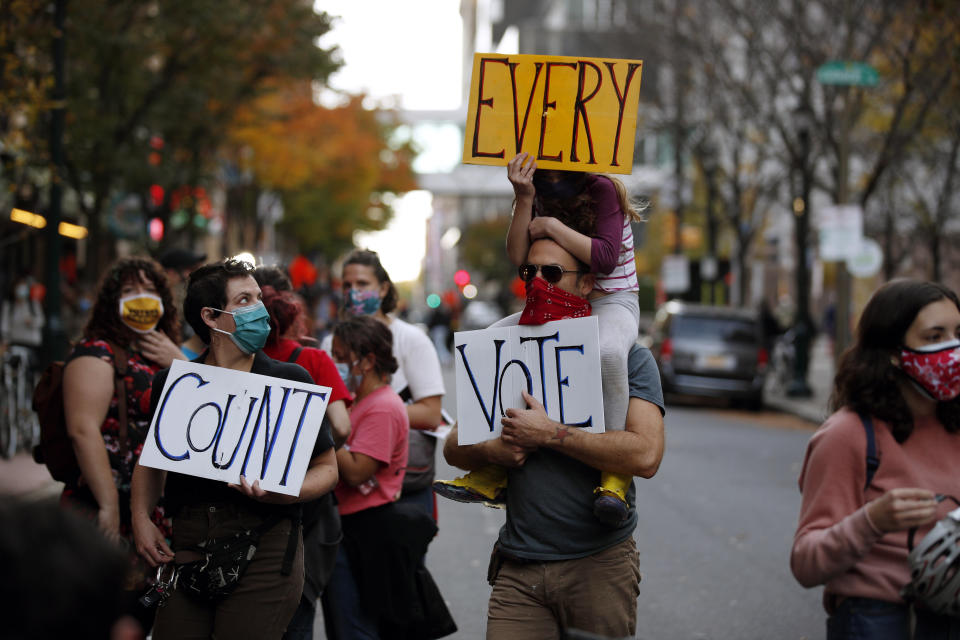 People urge for all votes to be counted during a demonstration outside the Pennsylvania Convention Center where votes are being counted, Thursday, Nov. 5, 2020, in Philadelphia, following Tuesday's election. (AP Photo/Rebecca Blackwell)