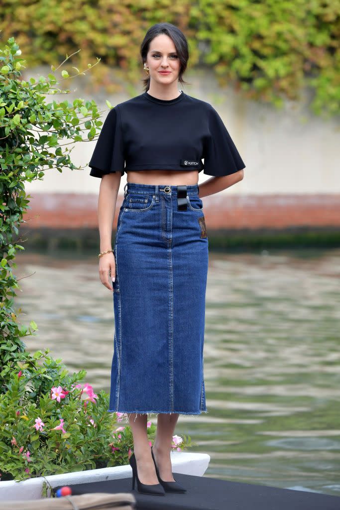 <p>The French actress oozed effortless elegance in a crop top and denim midi skirt by Louis Vuitton. </p>