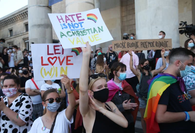 People take part in a rally in support of the LGBT community in Warsaw