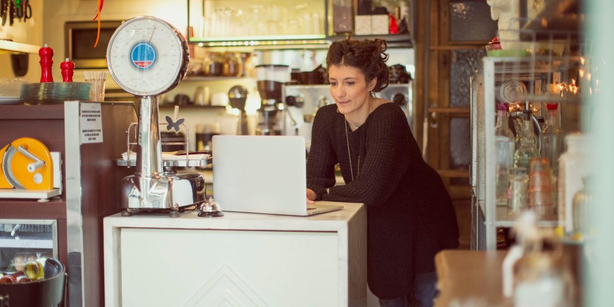 cafe owner using laptop