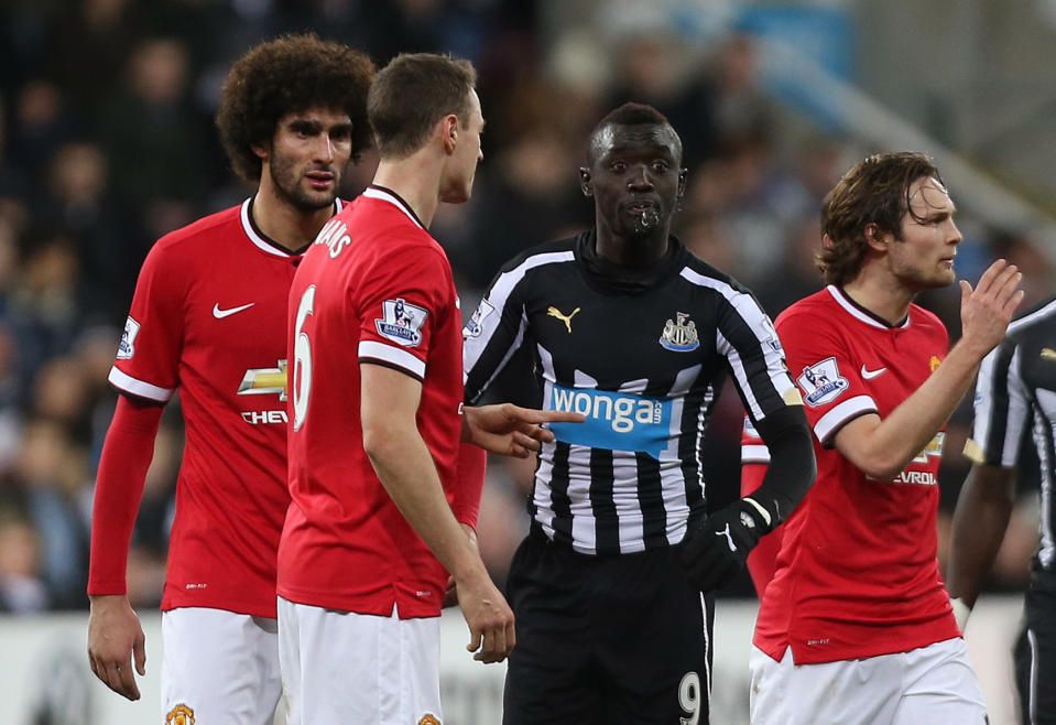 Football - Newcastle United v Manchester United - Barclays Premier League - St James' Park - 4/3/15 Manchester United's Jonny Evans clashes with Newcastle's Papiss Cisse as Cisse spits Action Images via Reuters / Lee Smith Livepic EDITORIAL USE ONLY. No use with unauthorized audio, video, data, fixture lists, club/league logos or "live" services. Online in-match use limited to 45 images, no video emulation. No use in betting, games or single club/league/player publications. Please contact your account representative for further details.