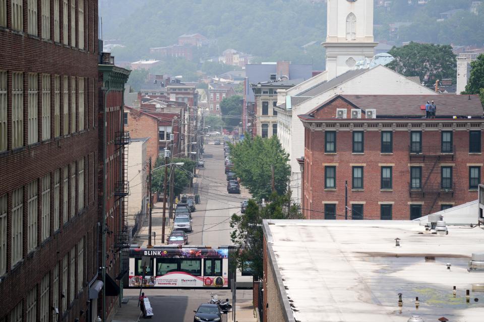 View looking north along Clay Street in Over-the-Rhine, as smoke from Canadian wildfires continues to drift southward into the United States, causing widespread air quality alerts throughout the Midwest, Wednesday, June 28, 2023, in Cincinnati. 