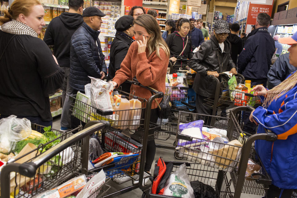 NEW YORK, NY - OCTOBER 27: A crowd of shoppers estimated in the thousands attend the opening of a new Wegmans supermarket despite heavy rain in a renovated section of the Brooklyn Navy Yard on October 27, 2019 in the Brooklyn borough of New York City. Wegmans, an upstate New York supermarket chain, is making its New York City debut with a 75,000-square-foot store. (Photo by Andrew Lichtenstein/Corbis via Getty Images)