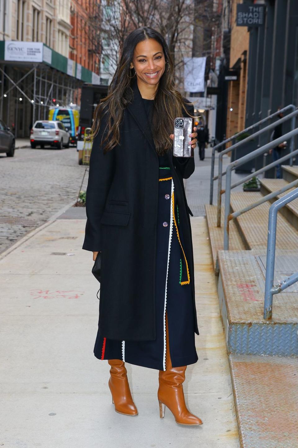 Zoe Saldana flashes a big smile in her second outfit for the day in New York City on February 8, 2022. - Credit: Felipe Ramales / SplashNews.com