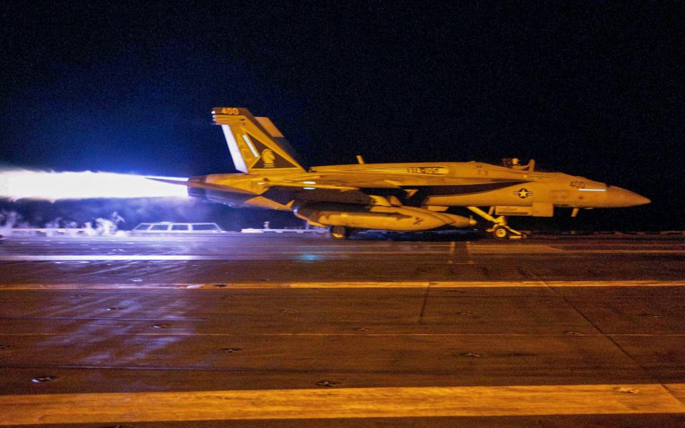 A fighter jet taking off from USS Dwight D. Eisenhower (CVN 69) during flight operations in response to increased Iranian-backed Houthi attacks on ships in the Red Sea